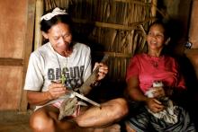 Mangyan couple playing their instrument