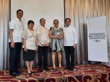 Information Services Division chief Antonieta Arceo and Information Technology Officer Joeven Calasagsag with DAP officials at GBPR 2019.