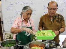 Duran Farm’s Luis Bausa assists 80-year-old Gilda Estipona during ATI Free Seminar on Lowland Vegetable Production and Processing